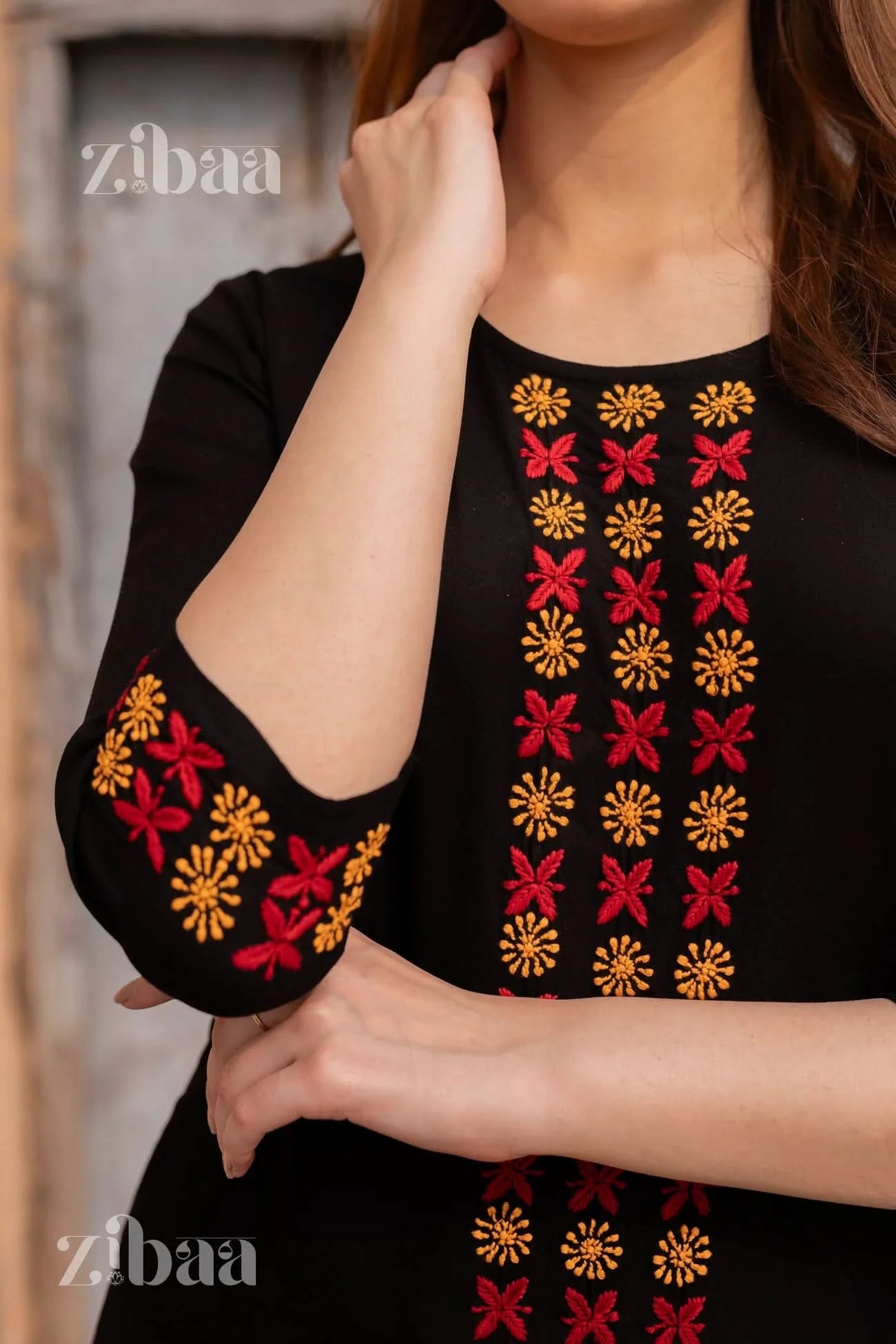 Detailed view of black chikankari kurti set with intricate chikankari patterns.