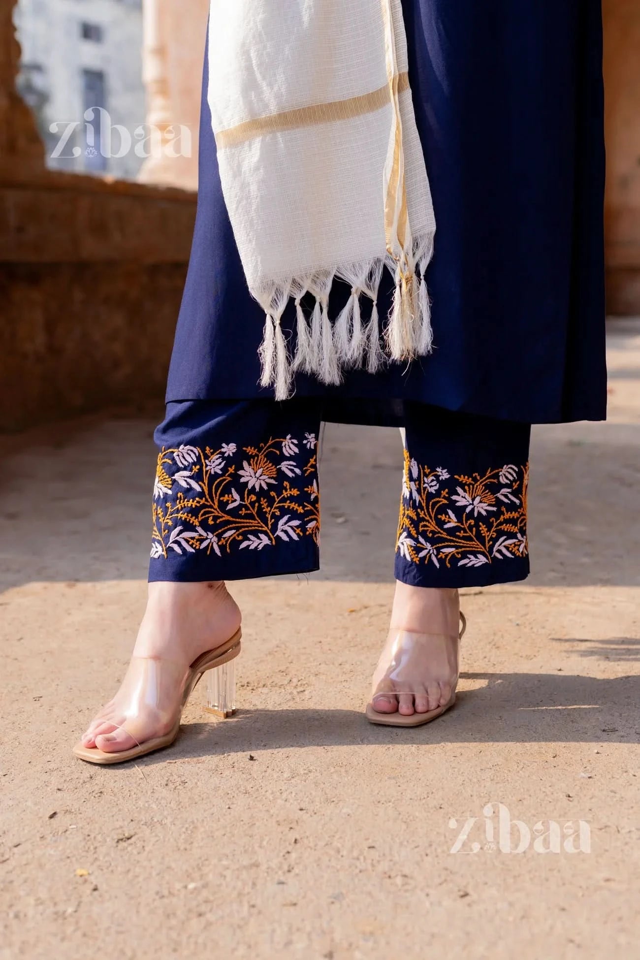 Close-up showcasing detailed chikankari embroidery on pants from a blue chikankari kurta set.