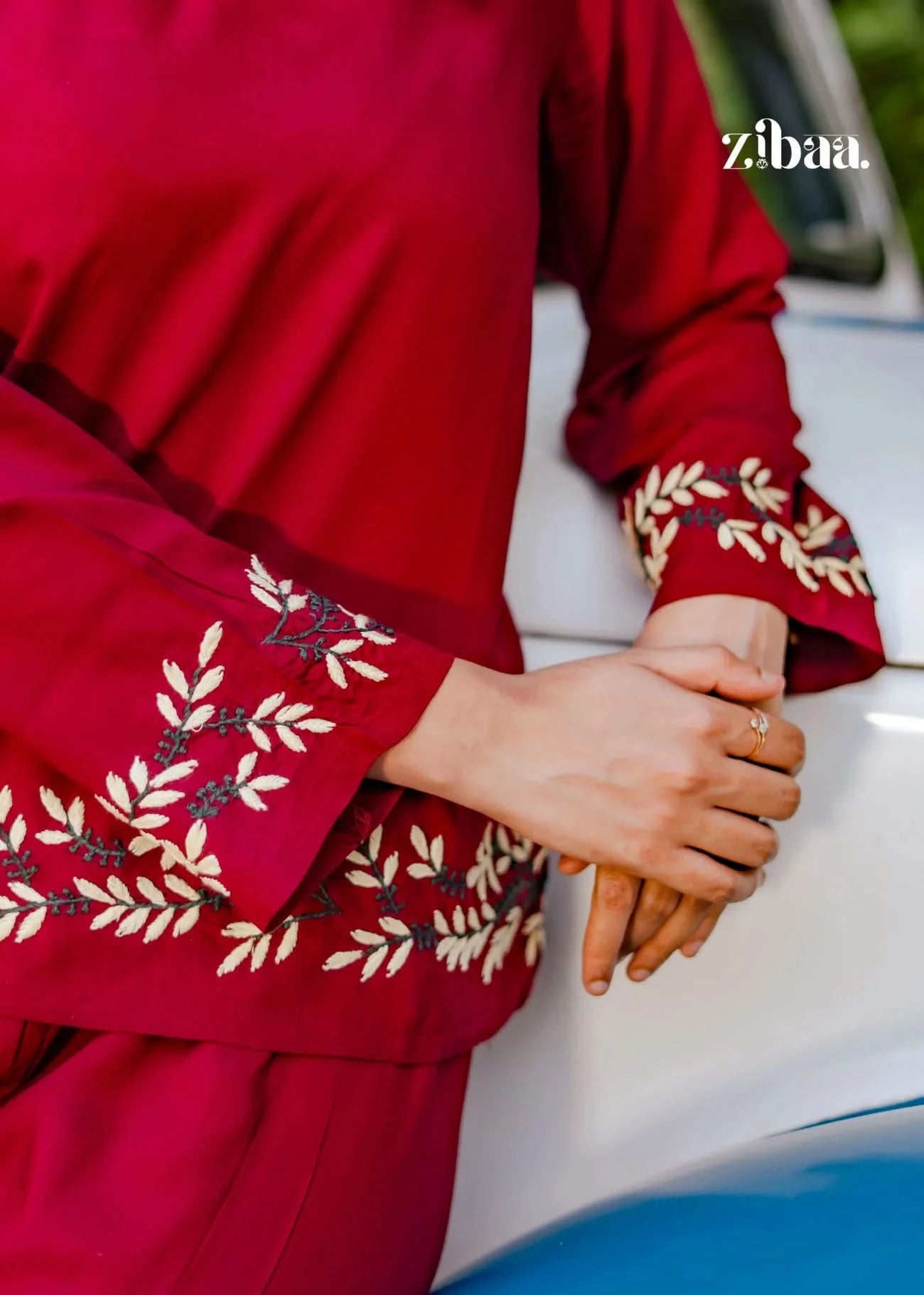 Close-up shot highlighting intricate chikankari embroidery patterns on burgundy chikankari coord set.