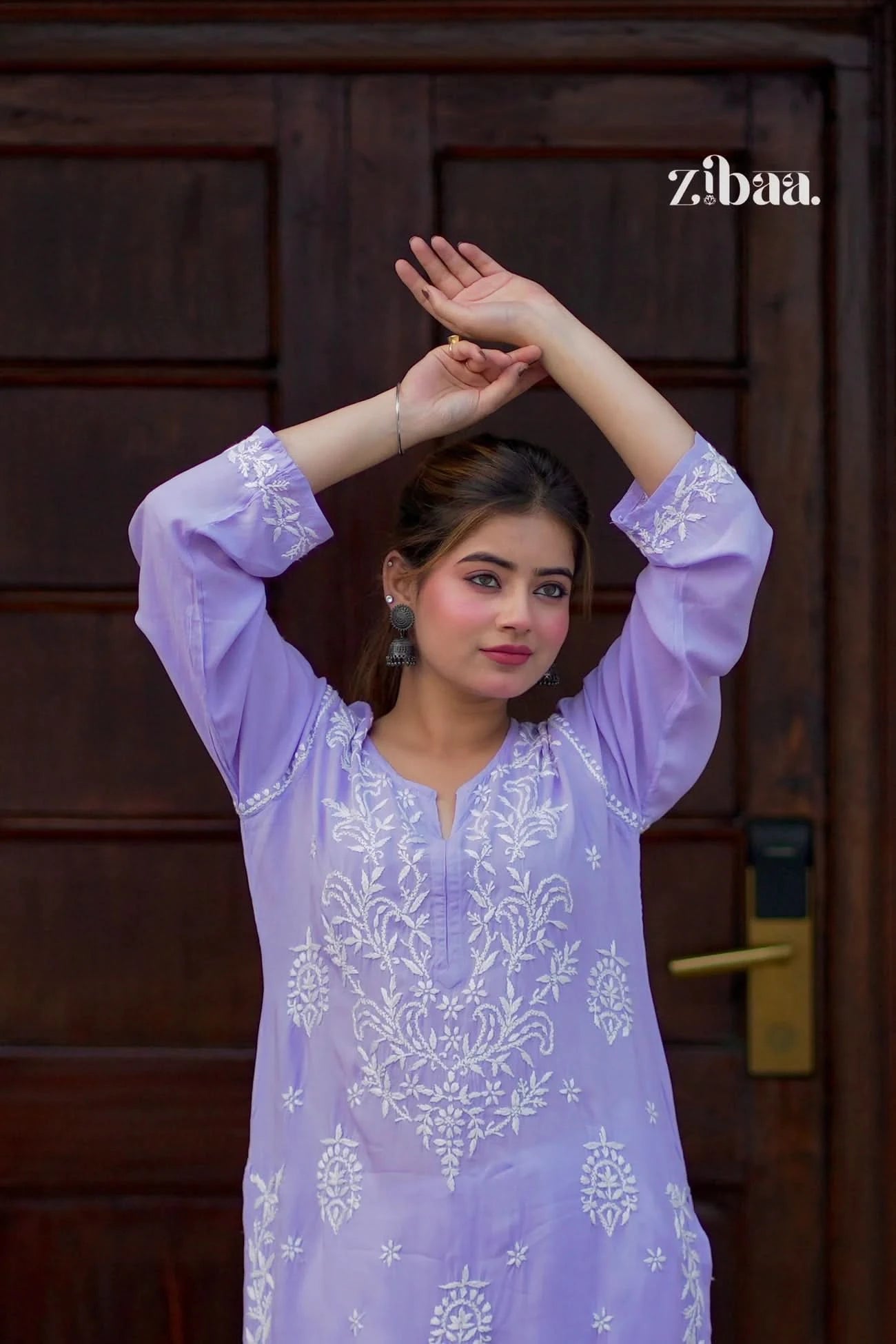 Lavender chikankari kurti worn outdoors, highlighting visible hand embroidery on fabric.