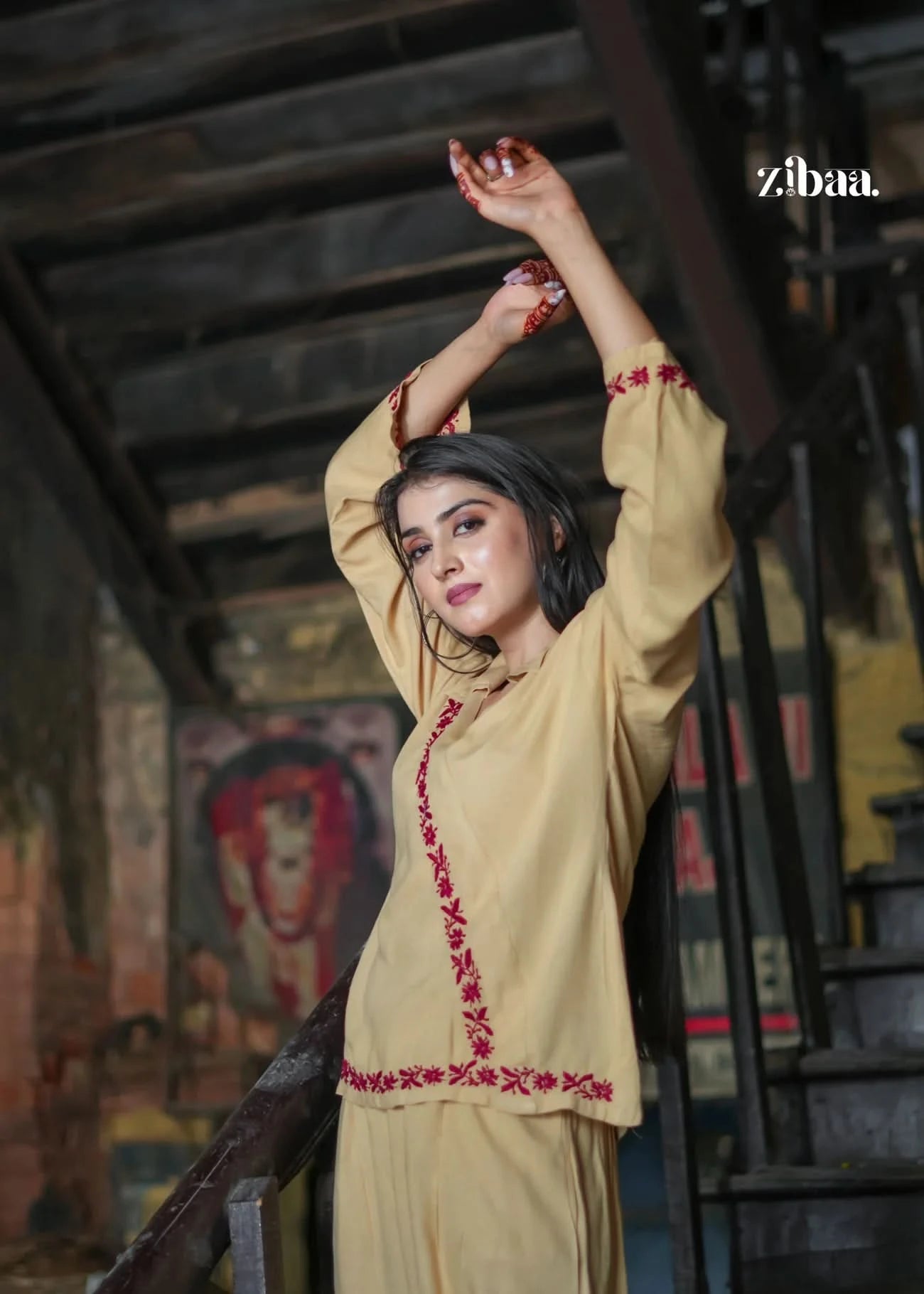 A zoomed-in view of the beige co-ord set with red embroidery, highlighting the craftsmanship and fabric quality. Great for showcasing product details on listings.