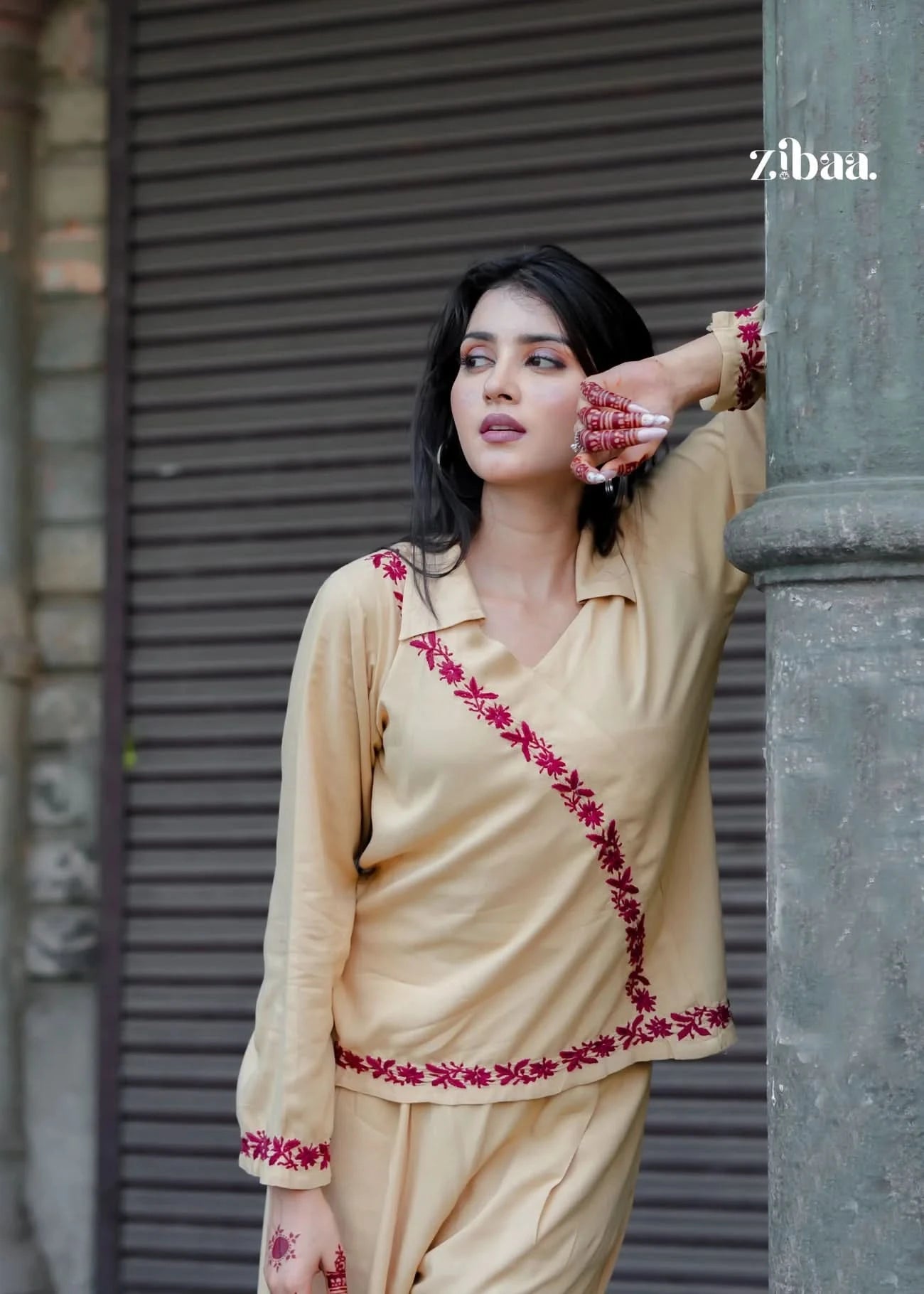 A complete look at the beige co-ord set with red embroidery, showcasing its comfortable fit and stylish appeal. Ideal for festive wear or everyday ethnic fashion.