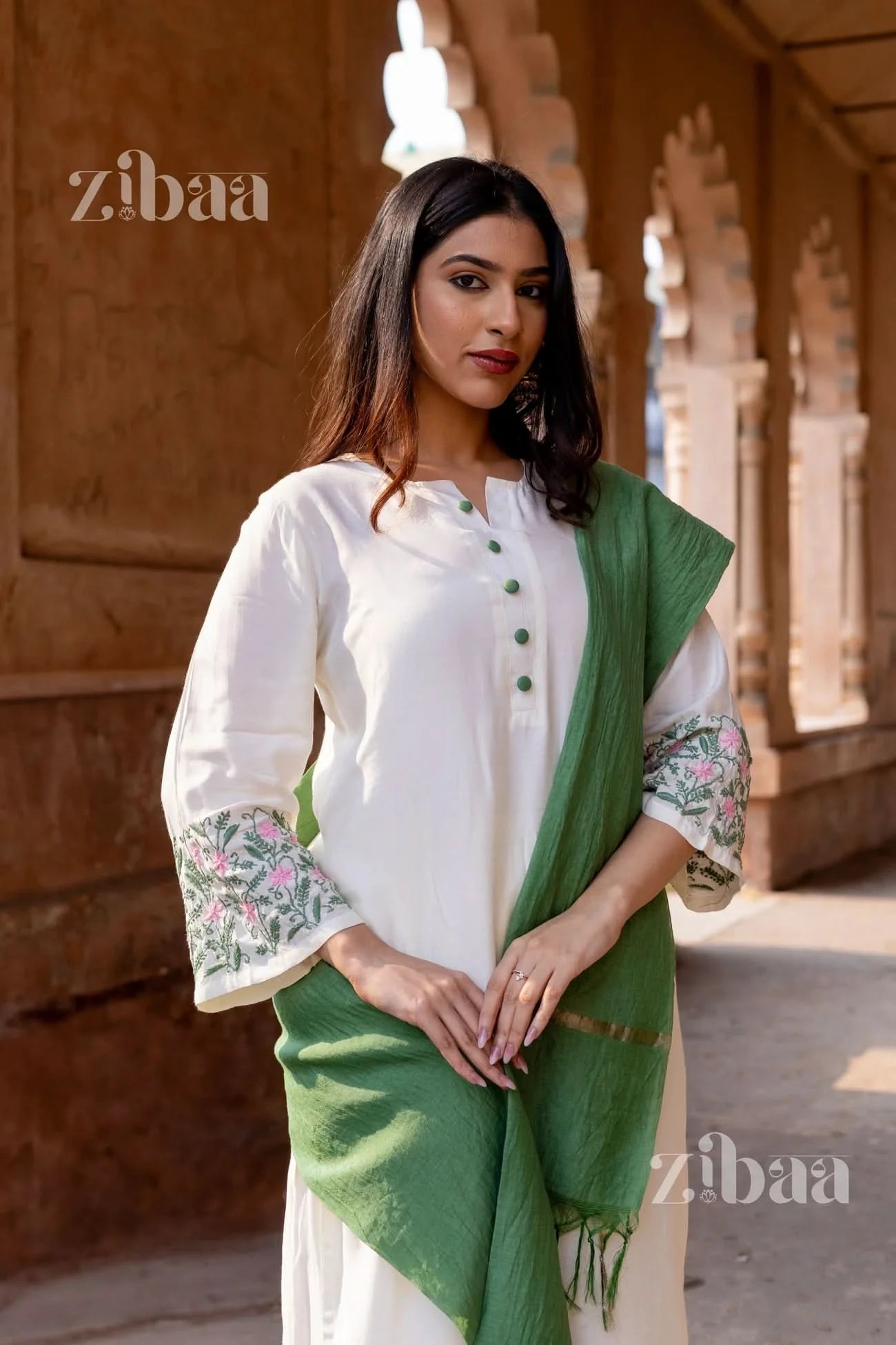 Traditional White Chikankari Kurta Set with floral detailing and sage green mulmul dupatta worn by a model.