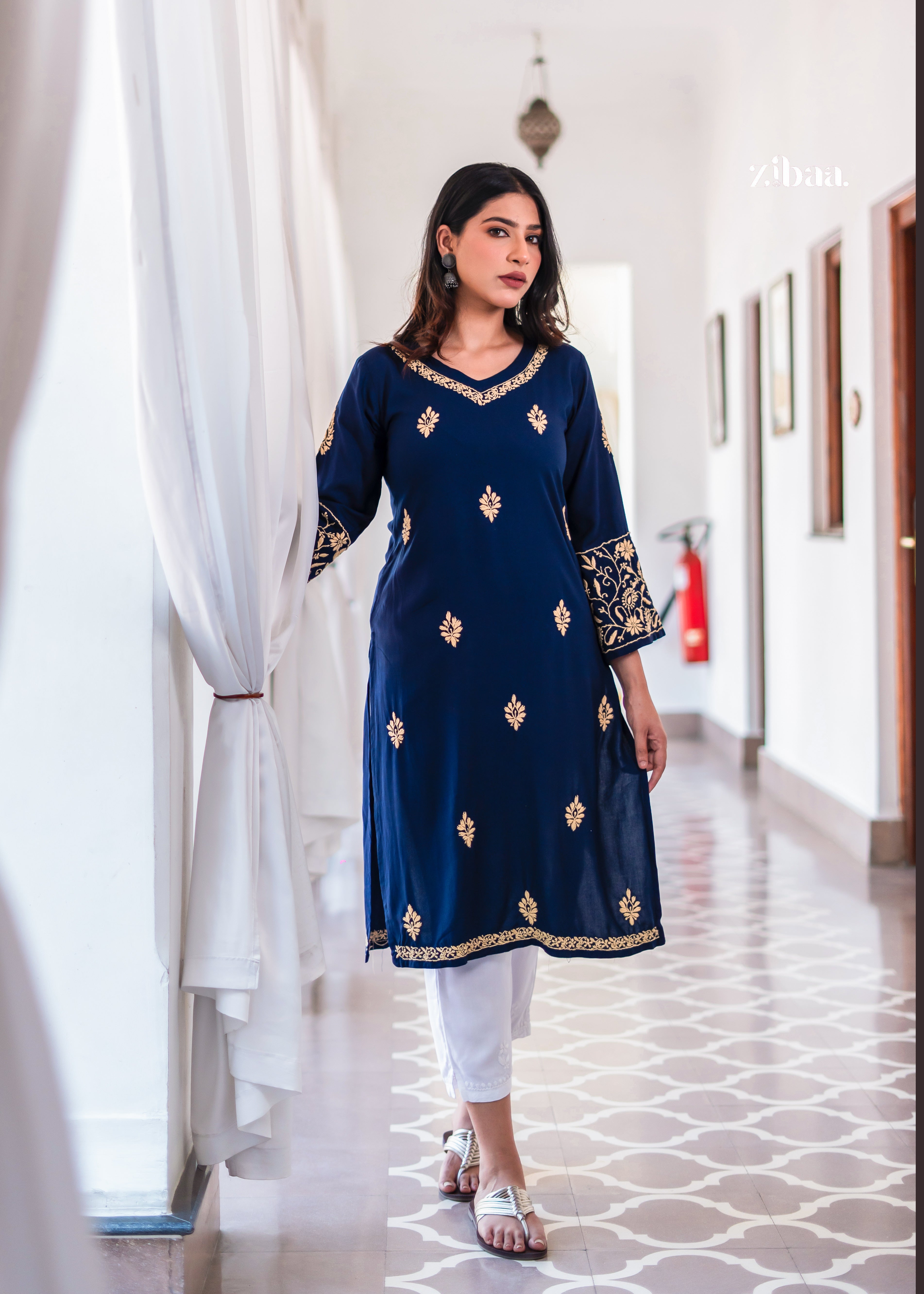 This navy blue kurta features golden embroidery motifs throughout.
Designed as a flowy ethnic wear piece for comfort and elegance. Perfect traditional outfit for festive wear and semi-formal events.