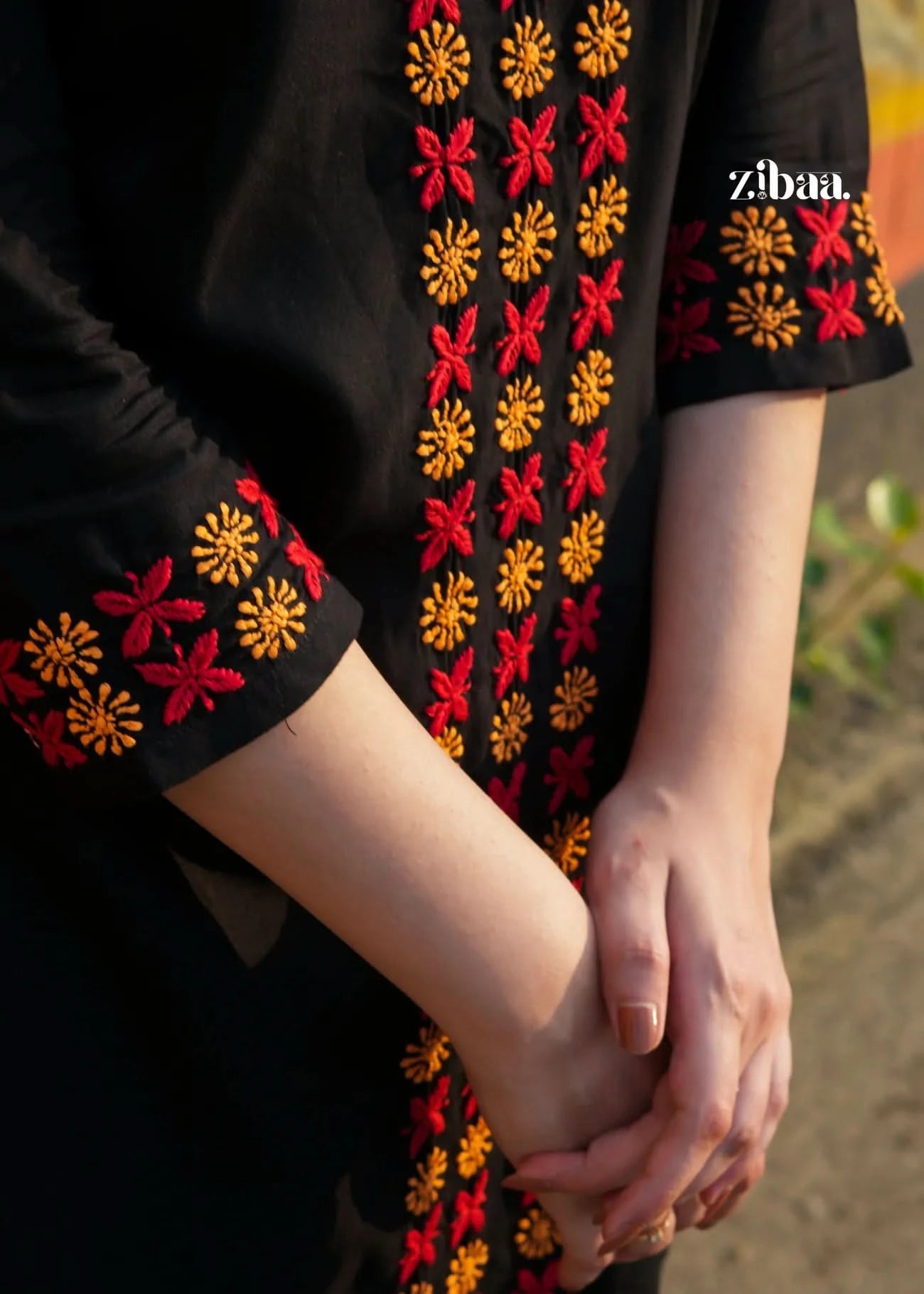 Zoomed-in view of black chikankari kurti chikankari kurti showcasing fine floral threadwork.