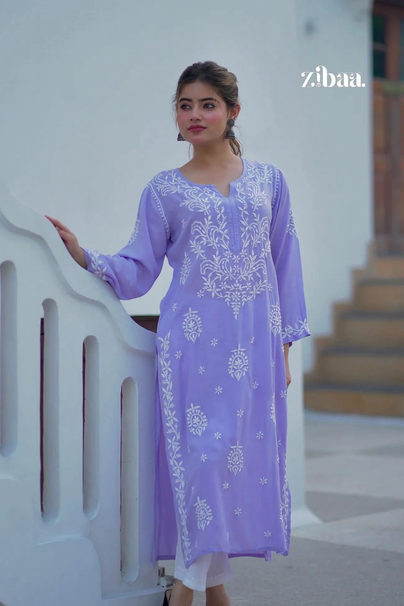 Lavender chikankari kurti worn outdoors, highlighting visible hand embroidery on fabric.