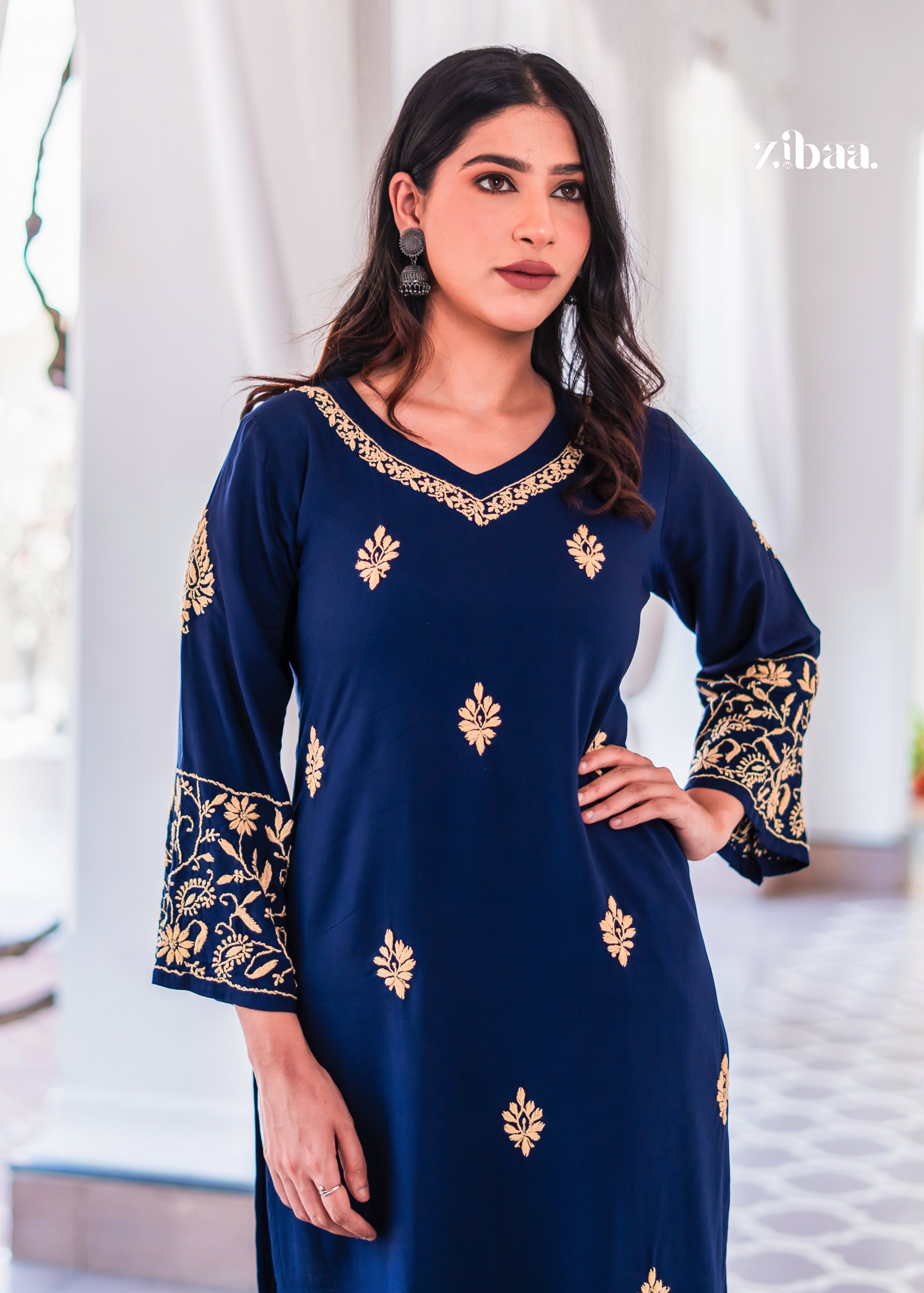 This elegant blue kurta is styled with golden embroidery on the neckline.
The embroidered bell sleeves enhance the festive and ethnic wear look.
Perfect traditional outfit for weddings, parties, and cultural gatherings.