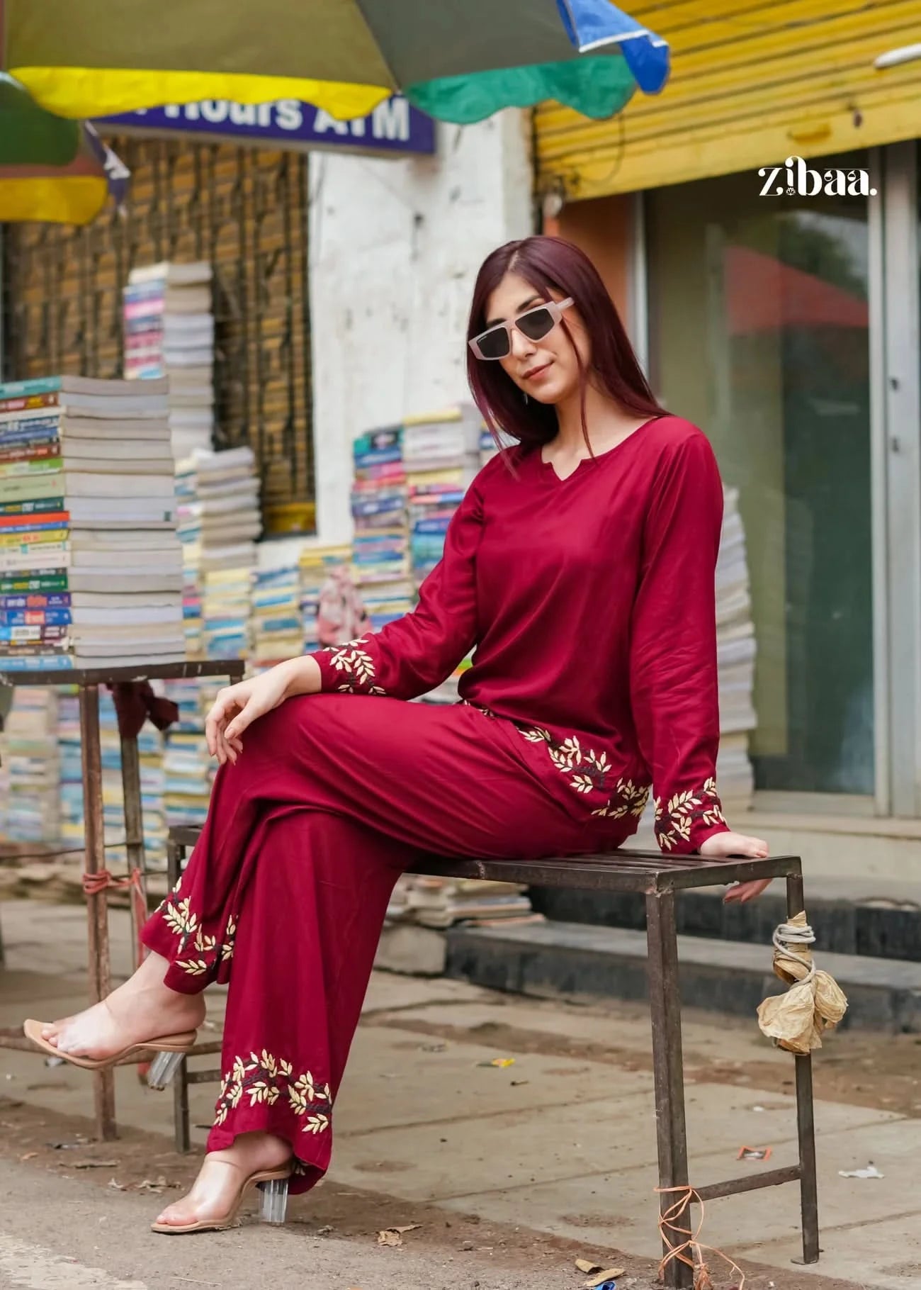 Wearing a burgundy chikankari coord set, the model poses outdoors highlighting elegant embroidery.