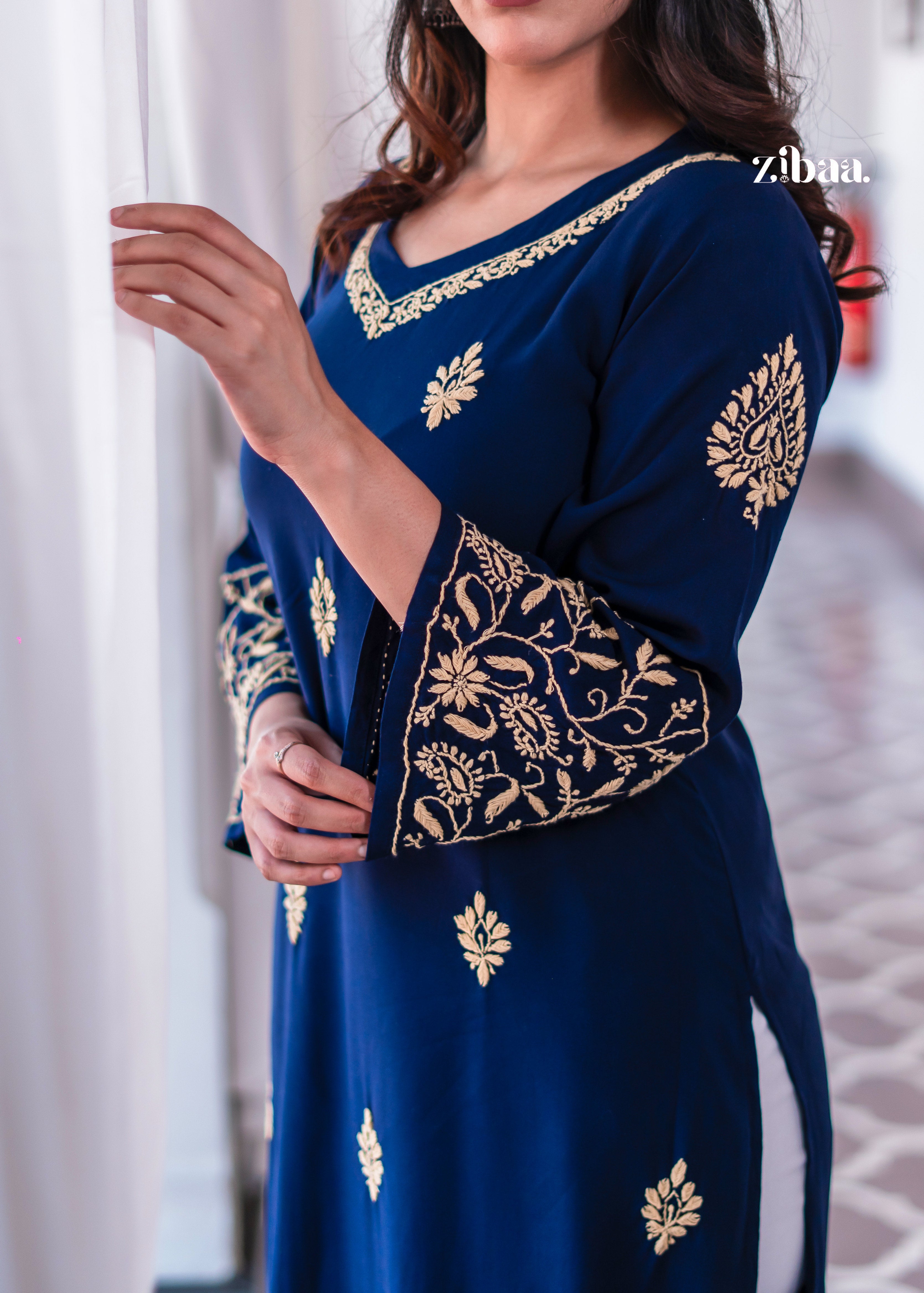 A detailed blue kurta with golden embroidery around the neckline.
The fine craftsmanship makes it an elegant ethnic wear choice. Perfect traditional outfit for festive wear and celebrations.