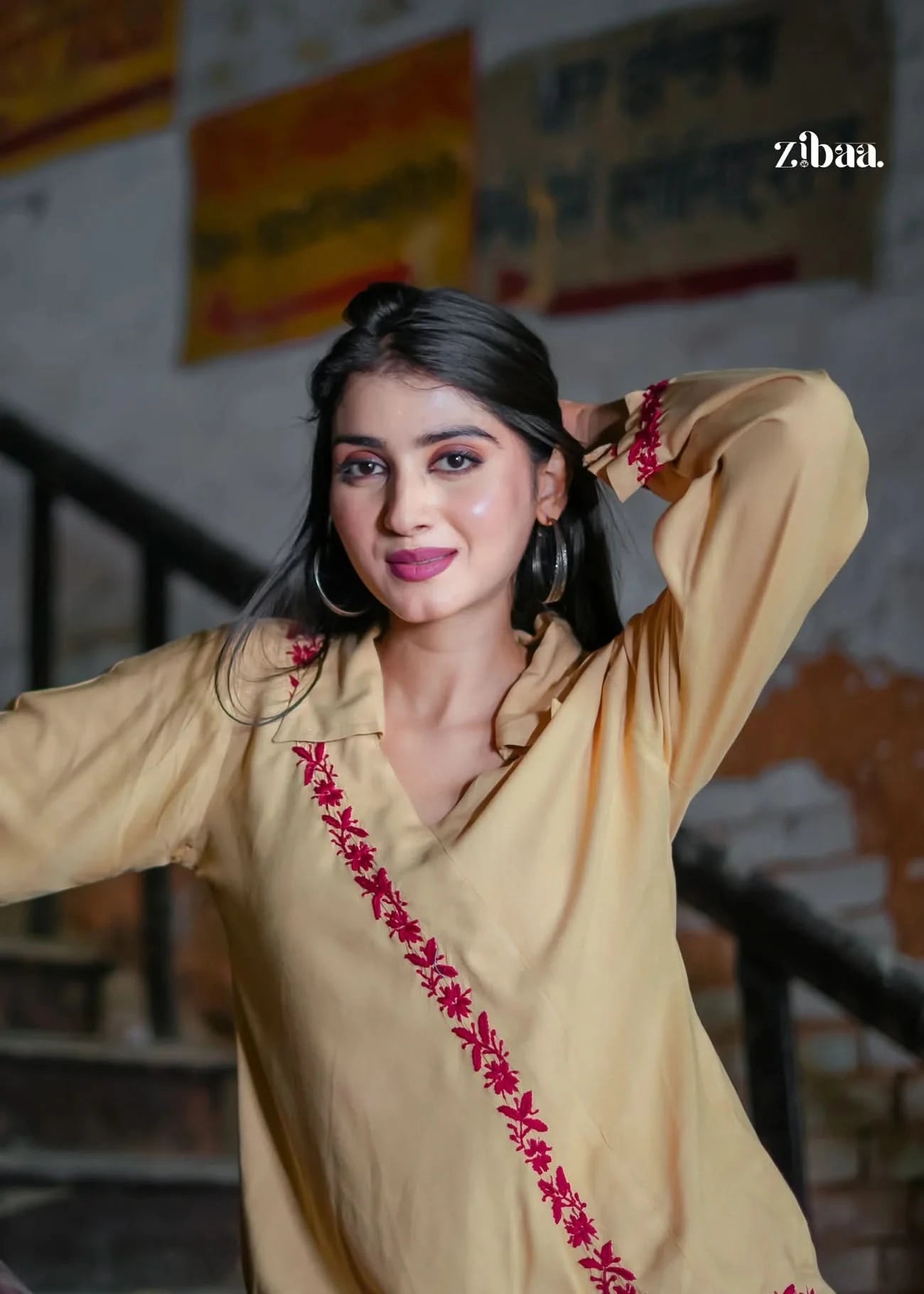 A graceful pose shows off this beige co-ord set with red embroidery, ideal for festive occasions and minimalist ethnic fashion lovers.