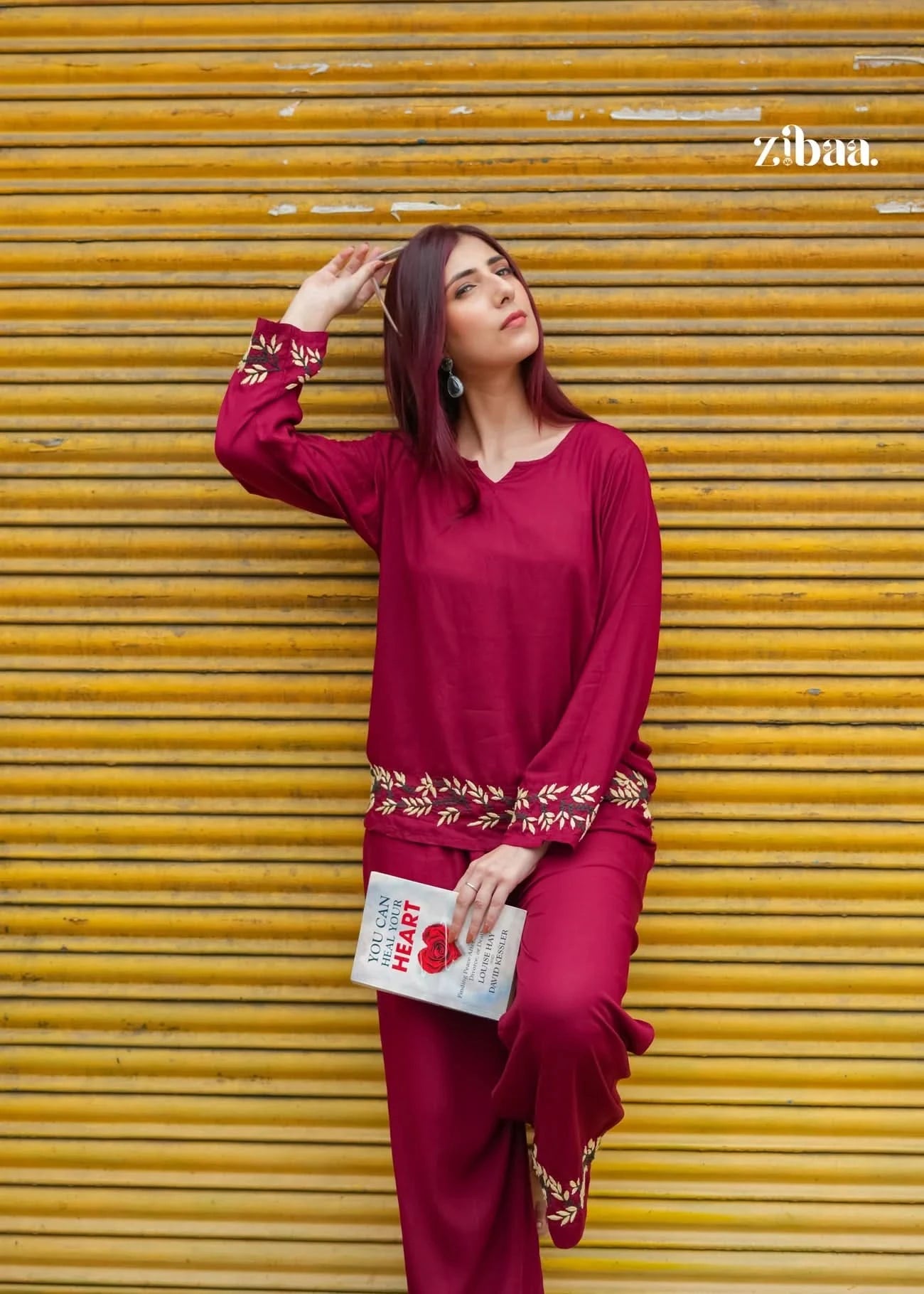 Model standing outdoors in a burgundy chikankari coord set showcasing fine embroidery.