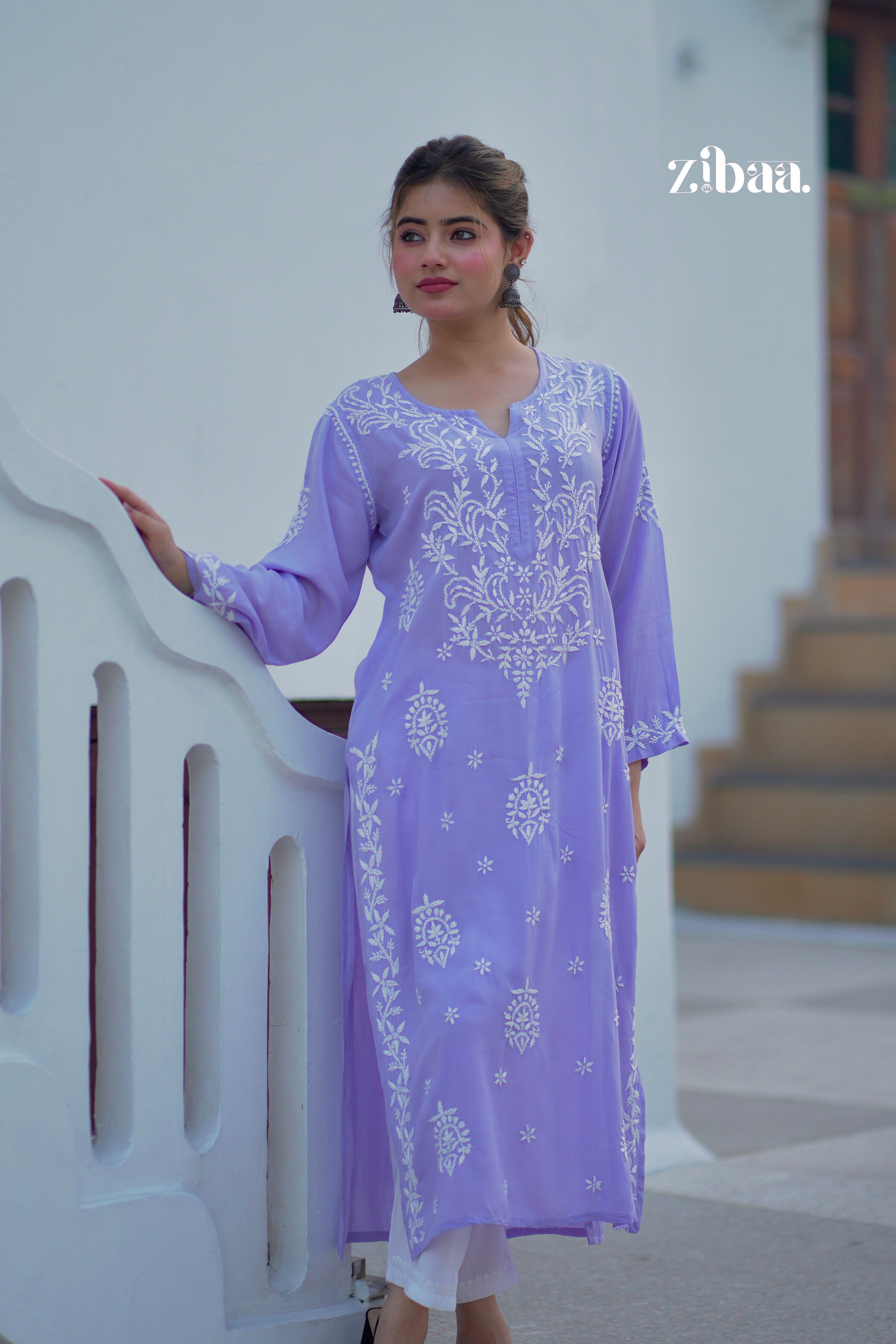 Lavender chikankari kurti worn outdoors, highlighting visible hand embroidery on fabric.